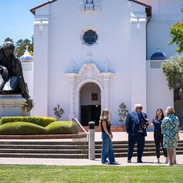 Roger in front of Chapel with students